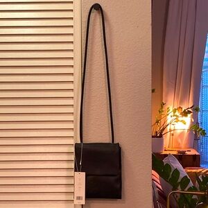 Vince real leather black cross body purse.
